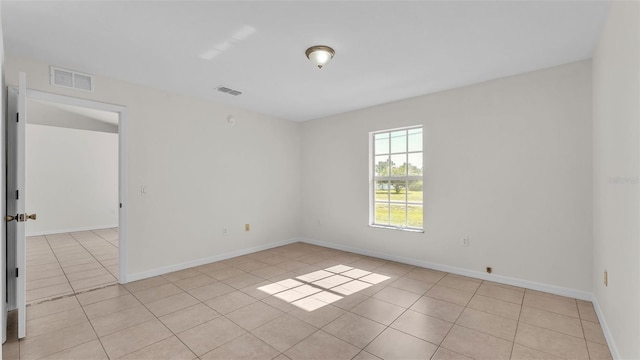 4515 Starfish Ave, Sebring, FL 33870 - empty room with light tile patterned flooring and baseboards