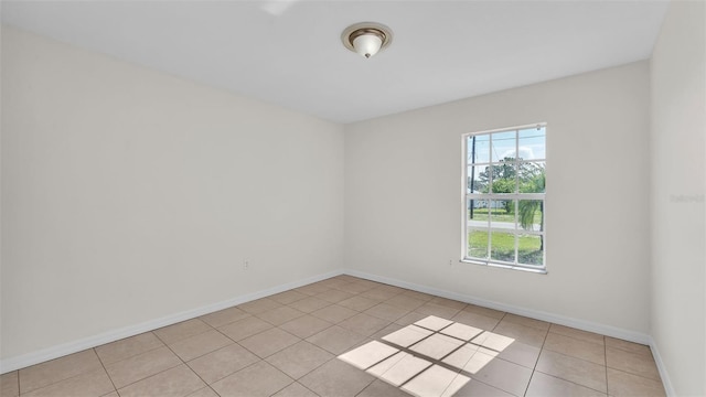 4515 Starfish Ave, Sebring, FL 33870 - spare room featuring light tile patterned floors and baseboards