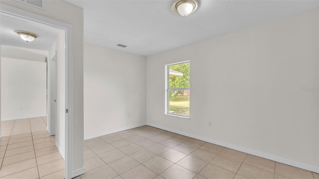 4515 Starfish Ave, Sebring, FL 33870 - empty room featuring light tile patterned flooring and baseboards