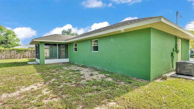 4515 Starfish Ave, Sebring, FL 33870 - rear view of property featuring stucco siding and a sunroom