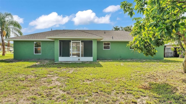 4515 Starfish Ave, Sebring, FL 33870 - back of property featuring a sunroom, stucco siding, and roof with shingles
