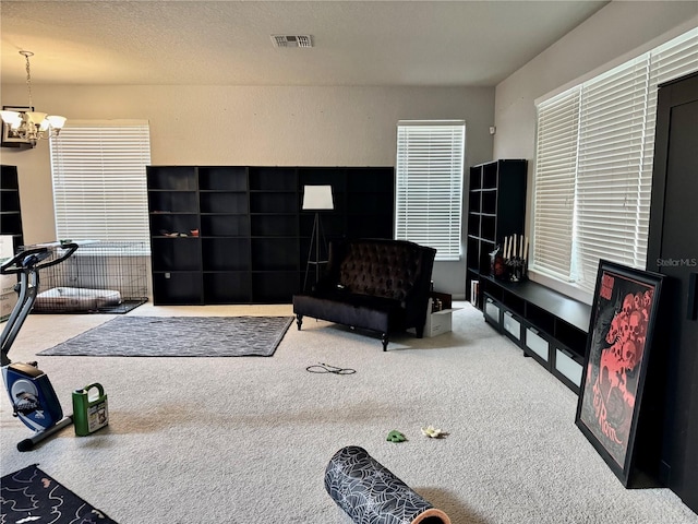 4665 SW 40th Pl, Ocala, FL 34474 - living area featuring carpet flooring, a chandelier, and healthy amount of natural light