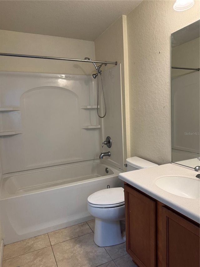 4665 SW 40th Pl, Ocala, FL 34474 - full bathroom with a textured wall, vanity, shower / bathtub combination, tile patterned floors, and a textured ceiling