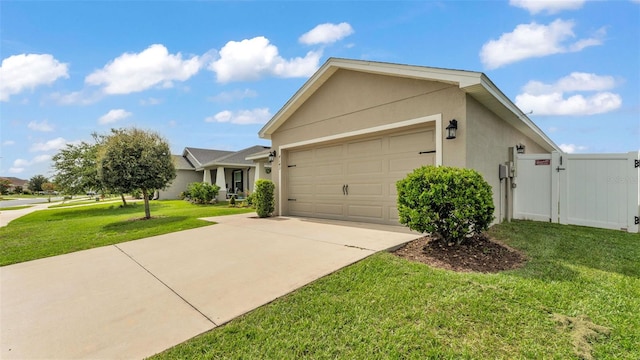 4143 Red Fern Ln, Lakeland, FL 33811 - view of front of home featuring driveway, stucco siding, a front lawn, an attached garage, and a gate