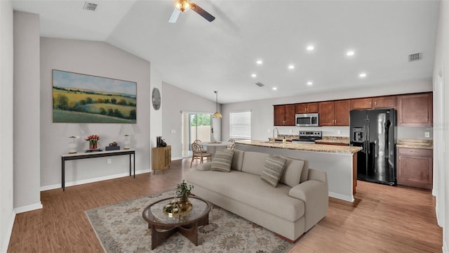 4143 Red Fern Ln, Lakeland, FL 33811 - living area with lofted ceiling, ceiling fan, light wood-style flooring, and recessed lighting