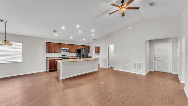 4143 Red Fern Ln, Lakeland, FL 33811 - kitchen with stainless steel appliances, ceiling fan, a center island with sink, open floor plan, and recessed lighting