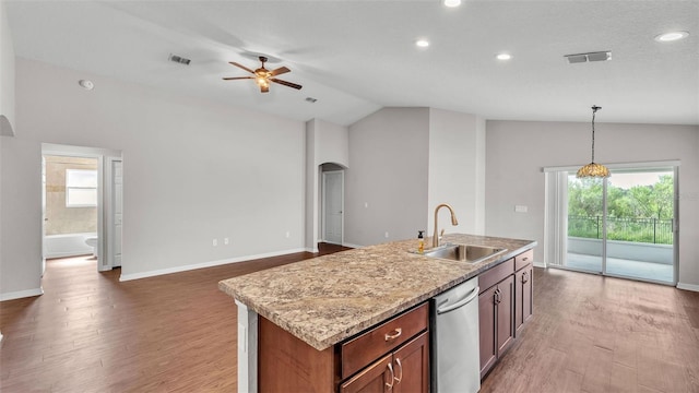 4143 Red Fern Ln, Lakeland, FL 33811 - kitchen with stainless steel dishwasher, arched walkways, vaulted ceiling, a ceiling fan, and light wood finished floors