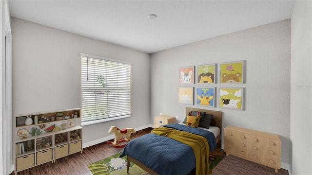 4143 Red Fern Ln, Lakeland, FL 33811 - bedroom featuring wood finished floors and baseboards