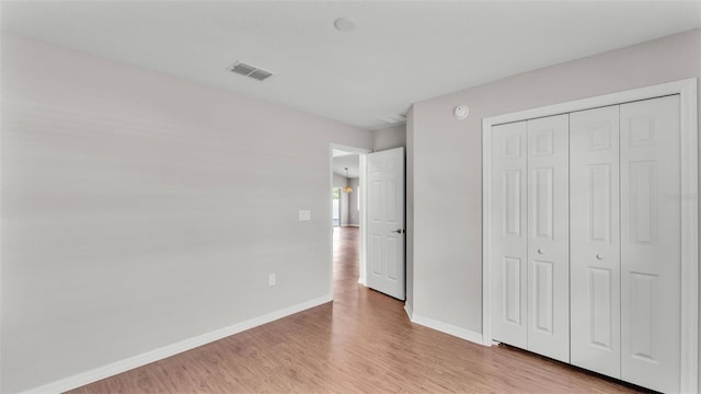 4143 Red Fern Ln, Lakeland, FL 33811 - unfurnished bedroom with light wood-style flooring and a closet