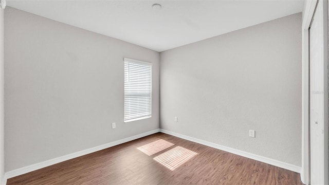 4143 Red Fern Ln, Lakeland, FL 33811 - spare room with baseboards and wood finished floors