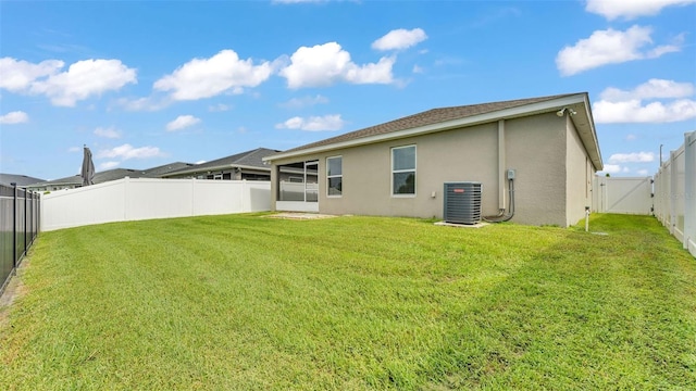 4143 Red Fern Ln, Lakeland, FL 33811 - back of property featuring stucco siding, a fenced backyard, a sunroom, and a gate