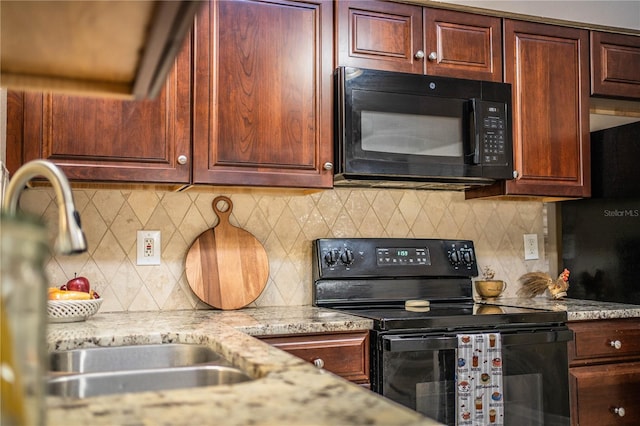 3582 Raintree Ct, Lakeland, FL 33803 - kitchen with black appliances, tasteful backsplash, and light stone counters