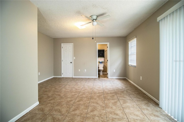 3582 Raintree Ct, Lakeland, FL 33803 - spare room with ceiling fan, a textured ceiling, and light tile patterned flooring