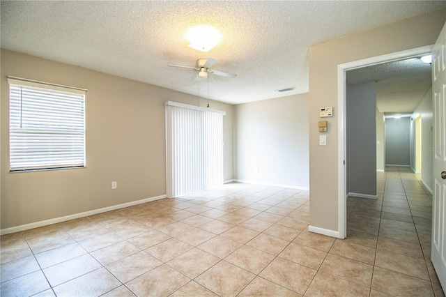 3582 Raintree Ct, Lakeland, FL 33803 - unfurnished room featuring ceiling fan, a textured ceiling, and light tile patterned flooring