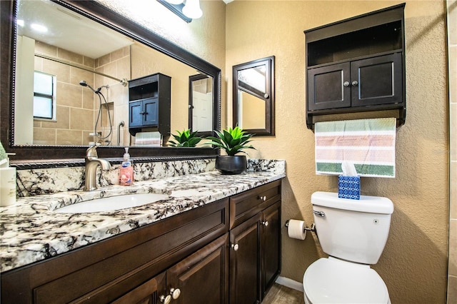 3582 Raintree Ct, Lakeland, FL 33803 - full bathroom with a textured wall, vanity, and tiled shower