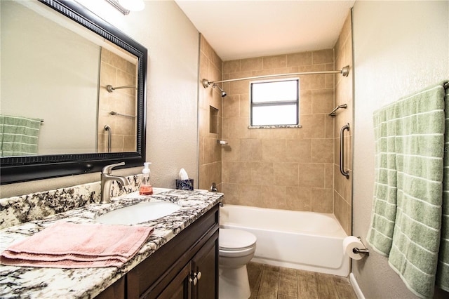 3582 Raintree Ct, Lakeland, FL 33803 - full bathroom featuring wood finished floors, vanity, and shower / bathtub combination