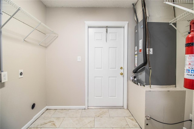3582 Raintree Ct, Lakeland, FL 33803 - laundry room featuring electric dryer hookup and baseboards