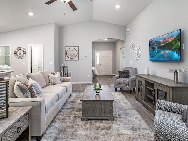 1496 Fleur Dr, Davenport, FL 33837 - living area with arched walkways, vaulted ceiling, ceiling fan, wood finished floors, and recessed lighting