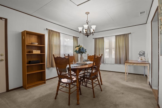 3521 Publix Rd, Lakeland, FL 33810 - carpeted dining area featuring a chandelier and baseboards