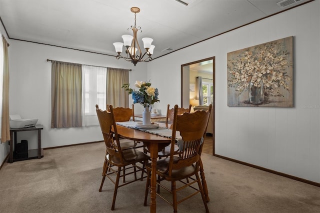 3521 Publix Rd, Lakeland, FL 33810 - carpeted dining room featuring plenty of natural light and a chandelier