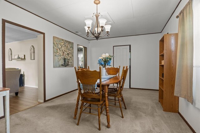 3521 Publix Rd, Lakeland, FL 33810 - dining area with a chandelier and light carpet