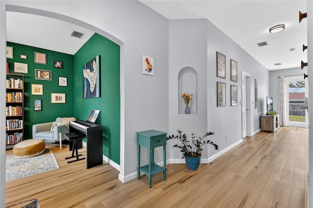 1026 Mohawk Ave NW, Palm Bay, FL 32907 - hallway with wood finished floors and arched walkways