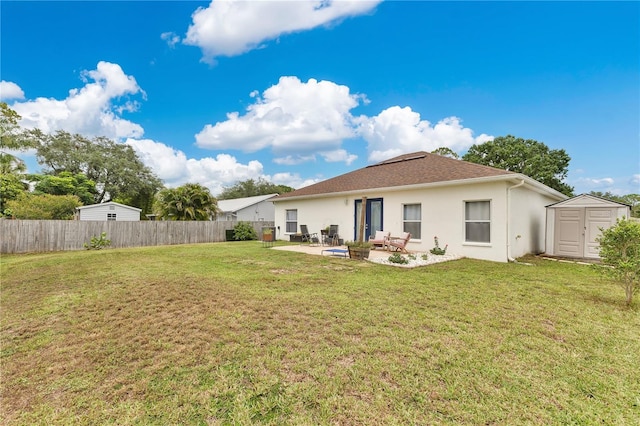 1026 Mohawk Ave NW, Palm Bay, FL 32907 - rear view of property featuring a shed, a patio area, and stucco siding