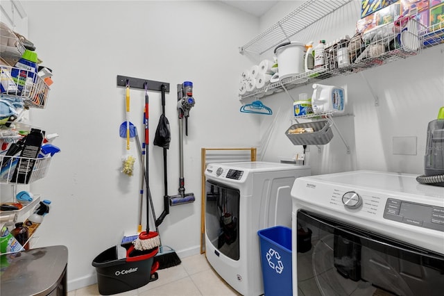 1026 Mohawk Ave NW, Palm Bay, FL 32907 - laundry area with independent washer and dryer and light tile patterned flooring