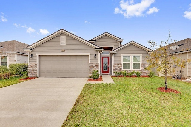 12586 Itani Way, Jacksonville, FL 32226 - single story home with an attached garage, concrete driveway, a front yard, and stone siding