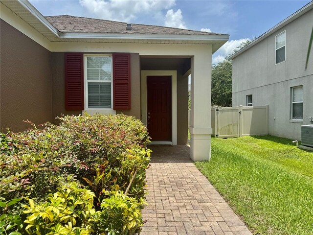 13303 Moss Park Ridge Dr, Orlando, FL 32832 - view of exterior entry featuring stucco siding