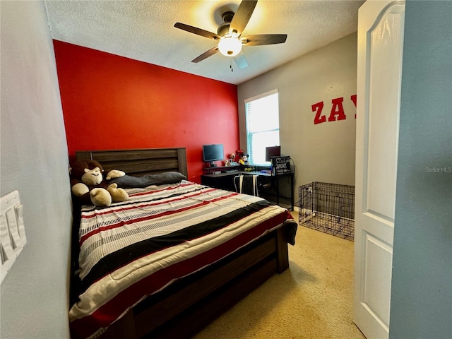 13303 Moss Park Ridge Dr, Orlando, FL 32832 - bedroom featuring light carpet, a ceiling fan, and a textured ceiling