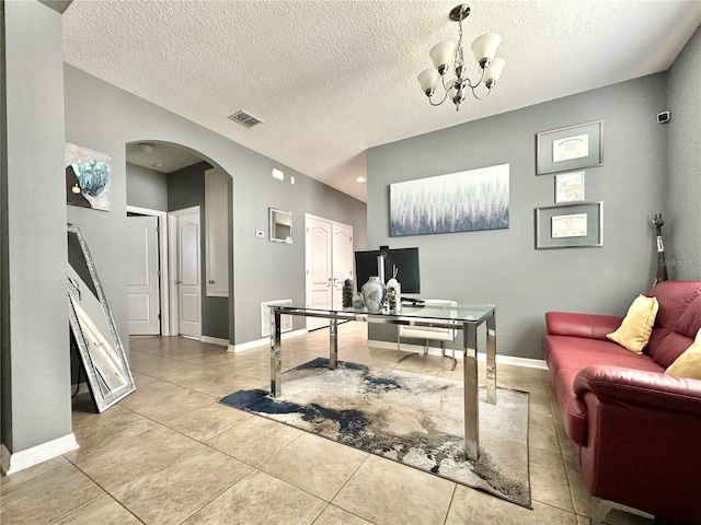 13303 Moss Park Ridge Dr, Orlando, FL 32832 - office space with arched walkways, light tile patterned flooring, a chandelier, and a textured ceiling