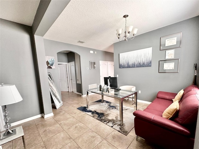13303 Moss Park Ridge Dr, Orlando, FL 32832 - office space with arched walkways, light tile patterned flooring, a chandelier, and a textured ceiling