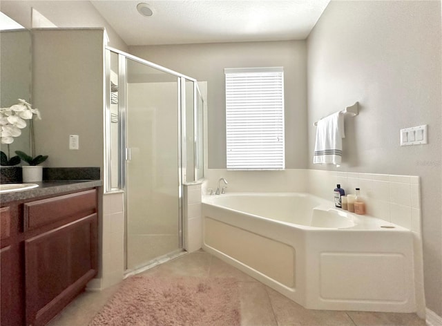 13303 Moss Park Ridge Dr, Orlando, FL 32832 - bathroom with a stall shower, vanity, a bath, and tile patterned floors