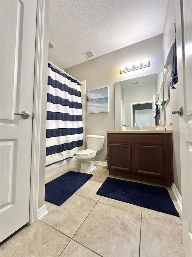 13303 Moss Park Ridge Dr, Orlando, FL 32832 - full bathroom with vanity, a shower with curtain, tile patterned floors, and a textured ceiling