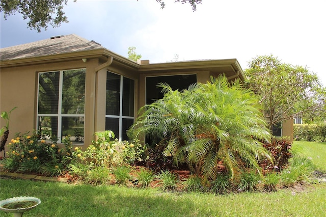 3023 Northfield Dr, Tarpon Springs, FL 34688 - view of home's exterior featuring stucco siding