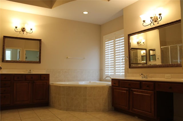 3023 Northfield Dr, Tarpon Springs, FL 34688 - full bathroom with tile patterned flooring, a bath, two vanities, and a stall shower