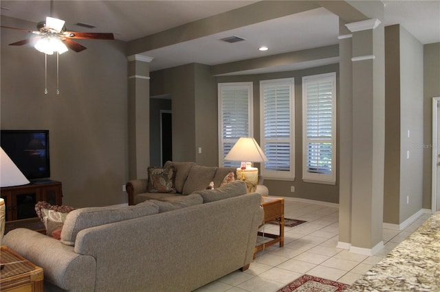 3023 Northfield Dr, Tarpon Springs, FL 34688 - living area with light tile patterned floors, ceiling fan, ornate columns, and recessed lighting