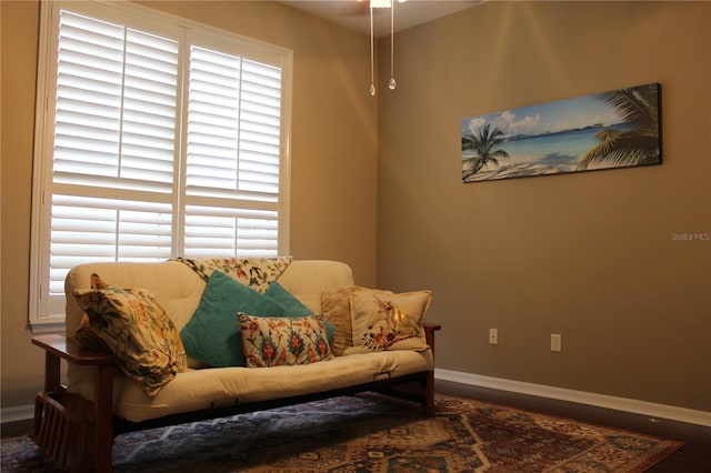 3023 Northfield Dr, Tarpon Springs, FL 34688 - sitting room with baseboards and wood finished floors