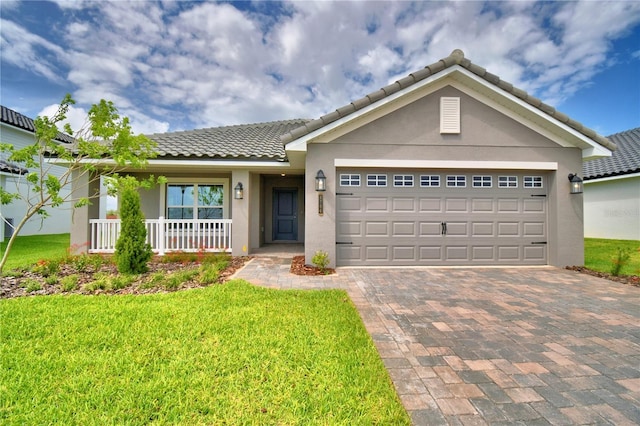 5427 Waterside Dr, Auburndale, FL 33823 - ranch-style house with stucco siding, driveway, a front yard, an attached garage, and a tiled roof