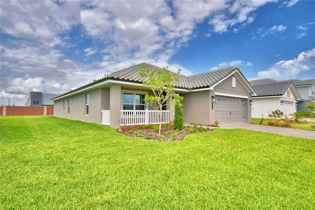5427 Waterside Dr, Auburndale, FL 33823 - ranch-style home with stucco siding, a garage, driveway, a tile roof, and a porch
