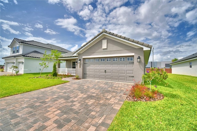 5427 Waterside Dr, Auburndale, FL 33823 - single story home featuring a tiled roof, decorative driveway, an attached garage, and a front yard