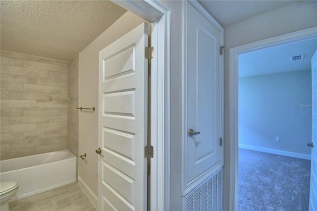5427 Waterside Dr, Auburndale, FL 33823 - bathroom featuring toilet and a textured ceiling