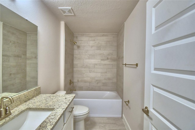 5427 Waterside Dr, Auburndale, FL 33823 - bathroom with vanity, a textured ceiling, and bathing tub / shower combination