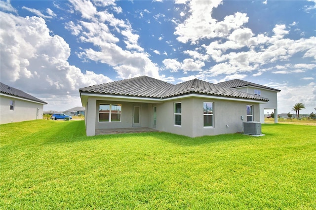 5427 Waterside Dr, Auburndale, FL 33823 - back of property featuring stucco siding, a yard, and a tiled roof
