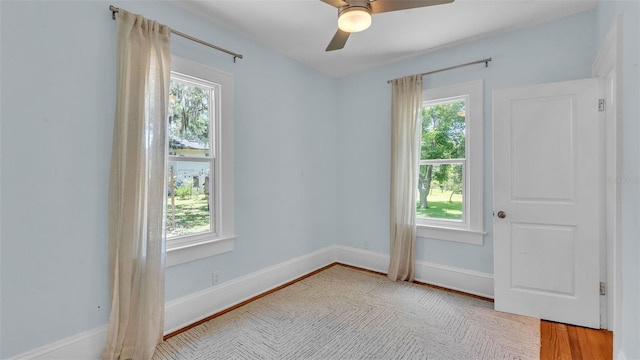 423 Ave H SE, Winter Haven, FL 33880 - empty room with a ceiling fan and wood finished floors