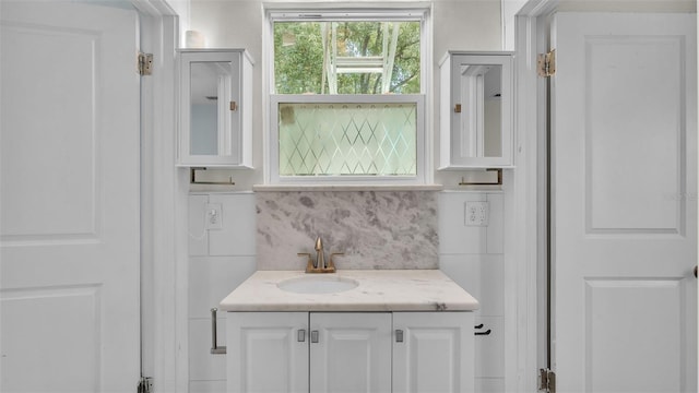 423 Ave H SE, Winter Haven, FL 33880 - bathroom featuring vanity and tasteful backsplash