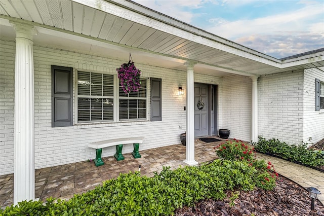 521 Lone Palm Dr, Lakeland, FL 33815 - entrance to property with a porch and brick siding