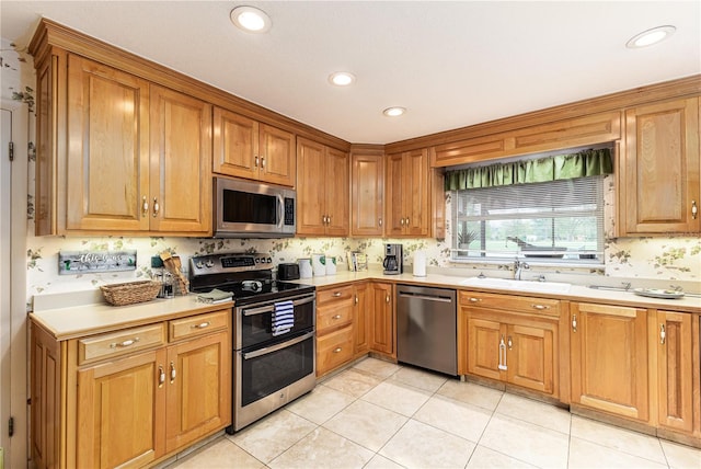 521 Lone Palm Dr, Lakeland, FL 33815 - kitchen featuring appliances with stainless steel finishes, light countertops, recessed lighting, and brown cabinetry
