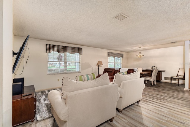 521 Lone Palm Dr, Lakeland, FL 33815 - living room with a textured ceiling and light wood finished floors